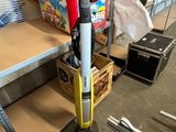 a vacuum that is sitting on the floor in a room