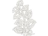 un gros plan d'une broche en forme de fleur en diamant sur fond blanc
