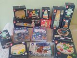a lot of toys that are sitting on a bed