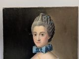 portrait of a woman in a blue dress with a blue bow tie