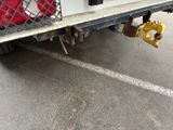 a red bag on the back of a white truck