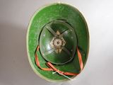 a green hat with a star on it sitting on a table