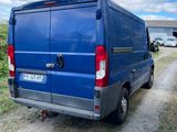 a blue van that is parked on the side of the road
