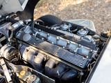 a close up view of a car engine with its hood open