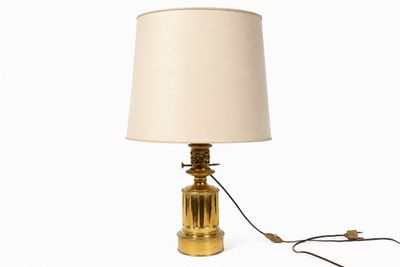 a lamp that is sitting on a table with a lamp on it
