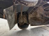a car that has been left on the ground with a tire