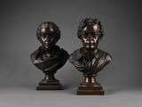 a pair of bronze busts of a man and a woman