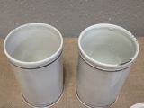 two cups that are sitting on a table