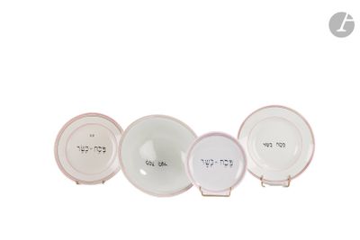 three white and pink plates with numbers on them sitting next to each other