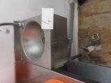 an orange ball sitting on the counter in the kitchen