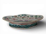a small bowl with a flower design on it
