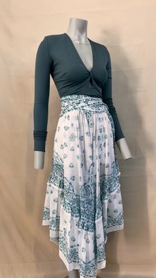 a mannequin wearing a dress with a blue top and white skirt