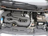 the engine of a car with its hood open and the hood up