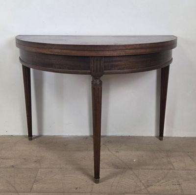 an image of a wooden table with a marble top on a hard wood floor
