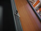 a dog that is sitting on the door of a building
