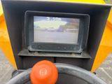steering wheel of a tractor with a monitor on the screen