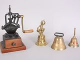 three different types of bells and a coffee grinder on a table