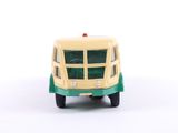 a green and yellow toy bus on a white surface