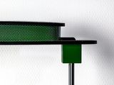 a green light that is on top of a metal pole