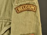 a close up of a military jacket with a patch on it