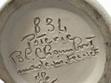 a white plate with writing on it on a white surface