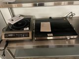 two burners on a metal shelf in a kitchen