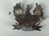 a bird that is sitting on a branch of a tree