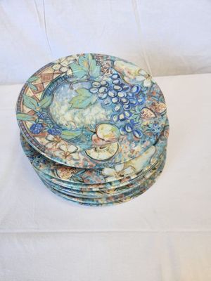 a lot of plates that are sitting on a table