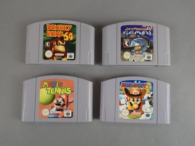 three nintendo game cartridges are lined up next to each other