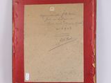 an old picture of a red frame with writing on it