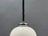 an image of a white light hanging from a ceiling