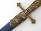 a blue and gold sword on a white surface