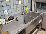 a kitchen with a sink and a stove in it