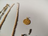 many different necklaces and bracelets that are on the table