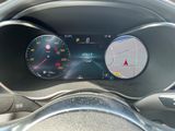 a close up of a car ' s dashboard with a speedometer