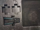 a picture of a tool set up on a black surface