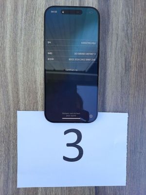 an image of a cell phone sitting on top of a wooden table