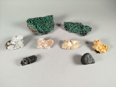 several different types of rocks and stones on a white surface