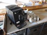 a coffee machine sitting on top of a kitchen counter