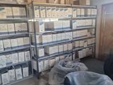 a room with a lot of boxes and boxes on the shelves