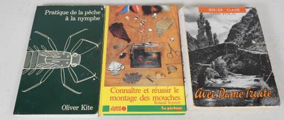 three books on a table with a picture of a bug and other items