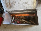 a box full of tools that are sitting on the floor