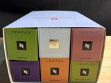 a close up of a box of four different flavors of vertuo