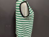 a green and white striped tank top on a mannequin mannequin