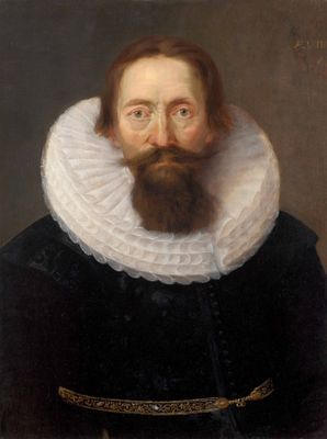portrait d'un homme barbu portant un col blanc et un costume noir
