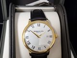 a watch that is sitting in a box on the table