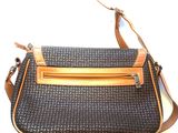 an image of a black and tan purse with a brown strap