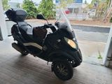 a scooter that is parked in a garage