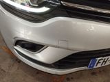 a close up of the front of a car with a license plate on it