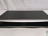 the sony dvd player is sitting on a white surface